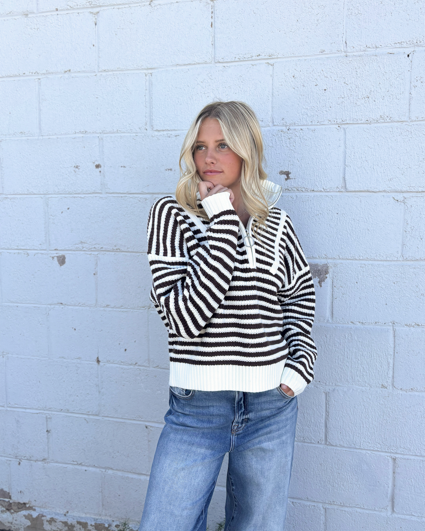 Sweater with mocha colored stripes and a half zip collar
