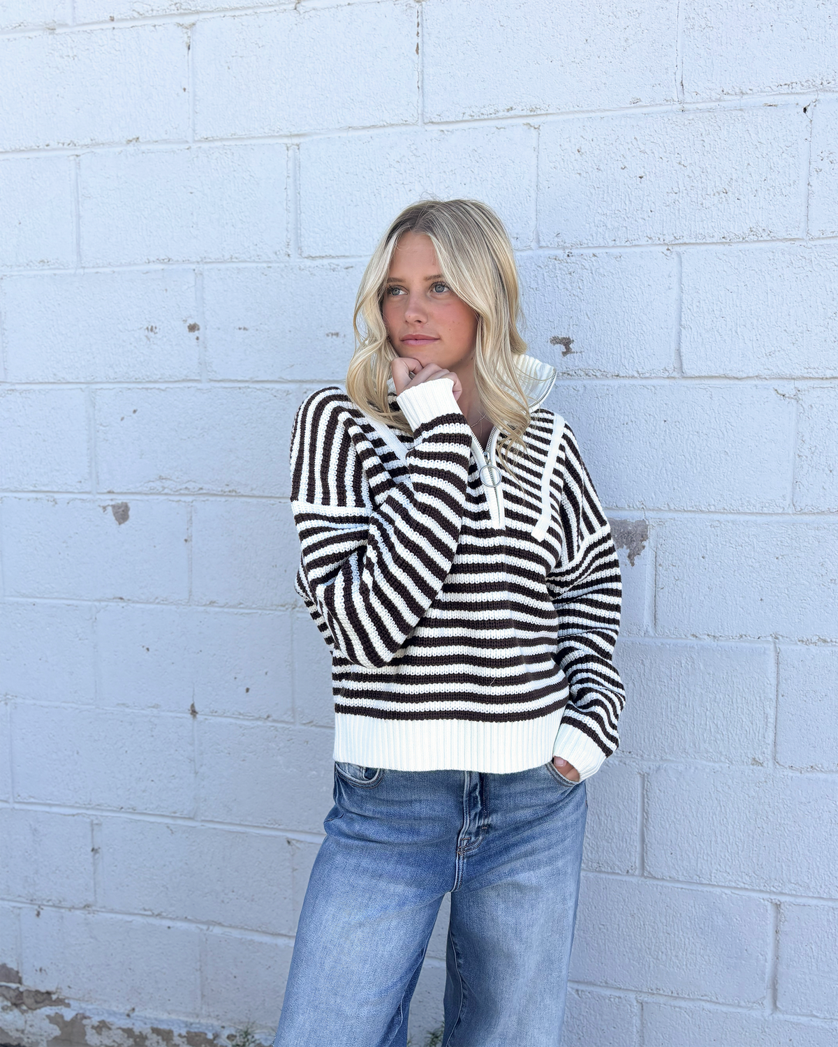 Sweater with mocha colored stripes and a half zip collar