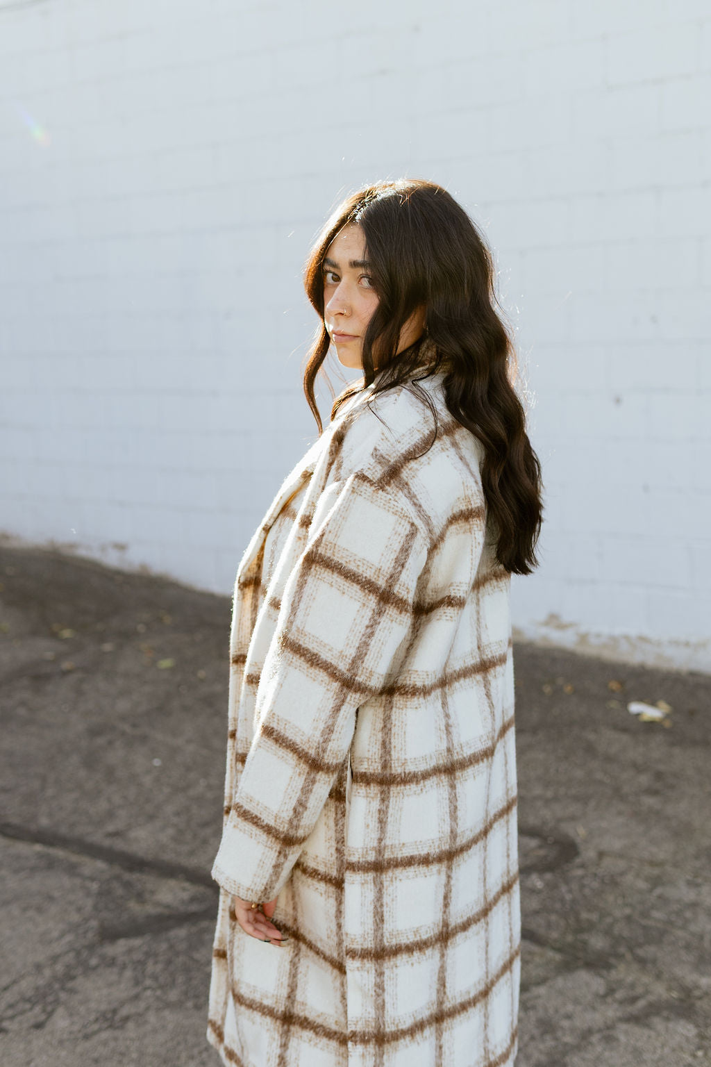 Ivory trench coat with tan plaid lines