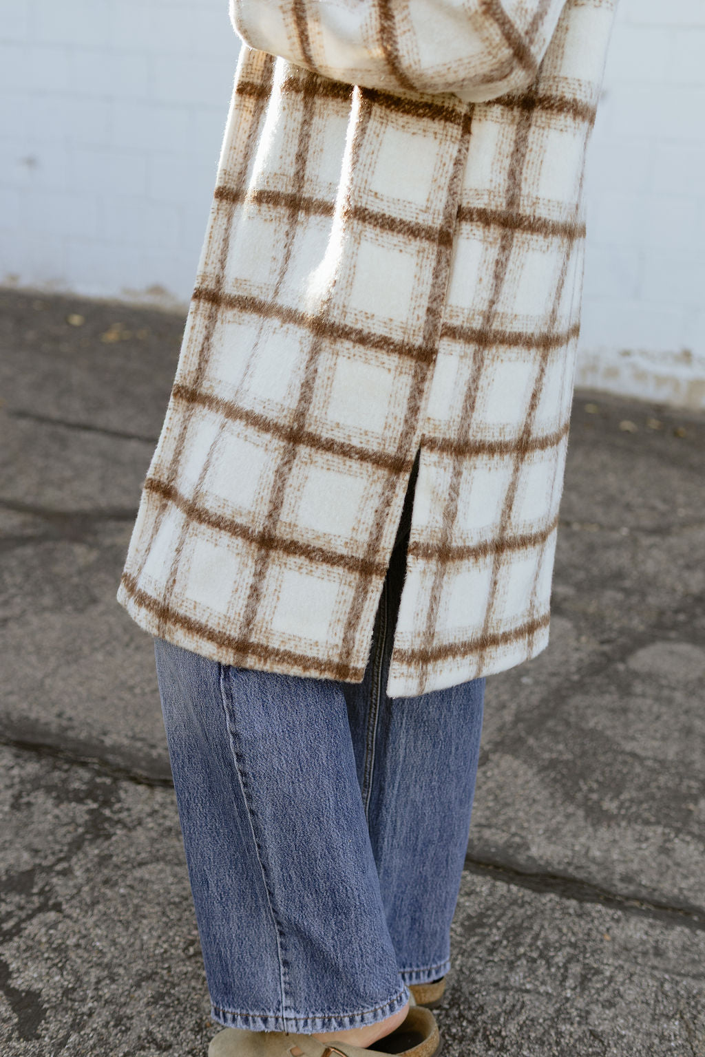 Ivory trench coat with tan plaid lines