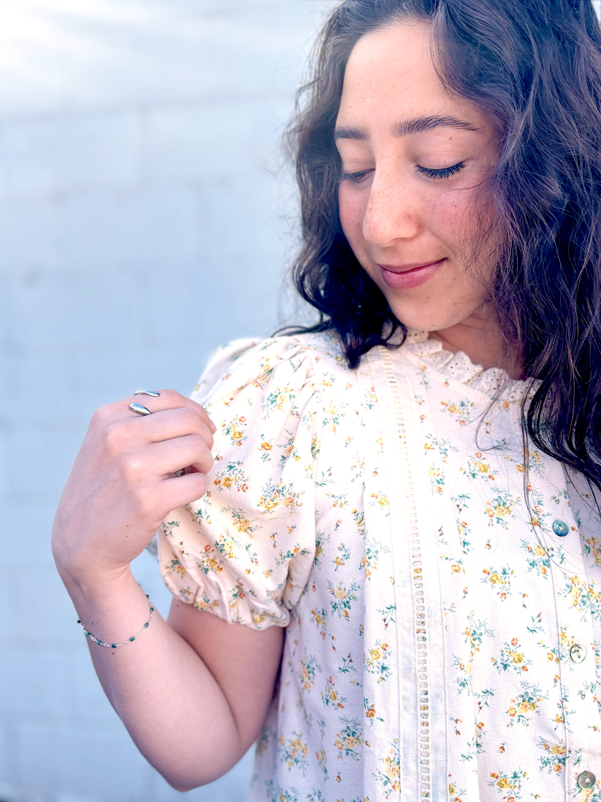 Yellow flowered top with large lace trim along the bottom