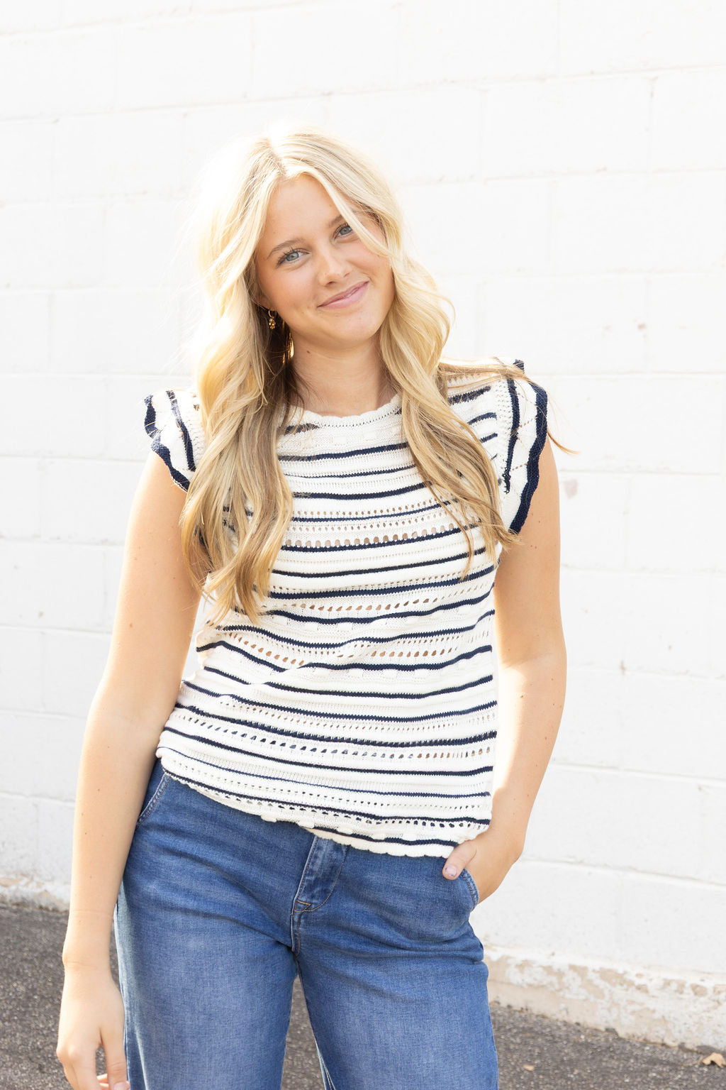 white sleeveless sweater with navy stripes