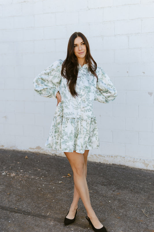 white a-line dress with green floral print