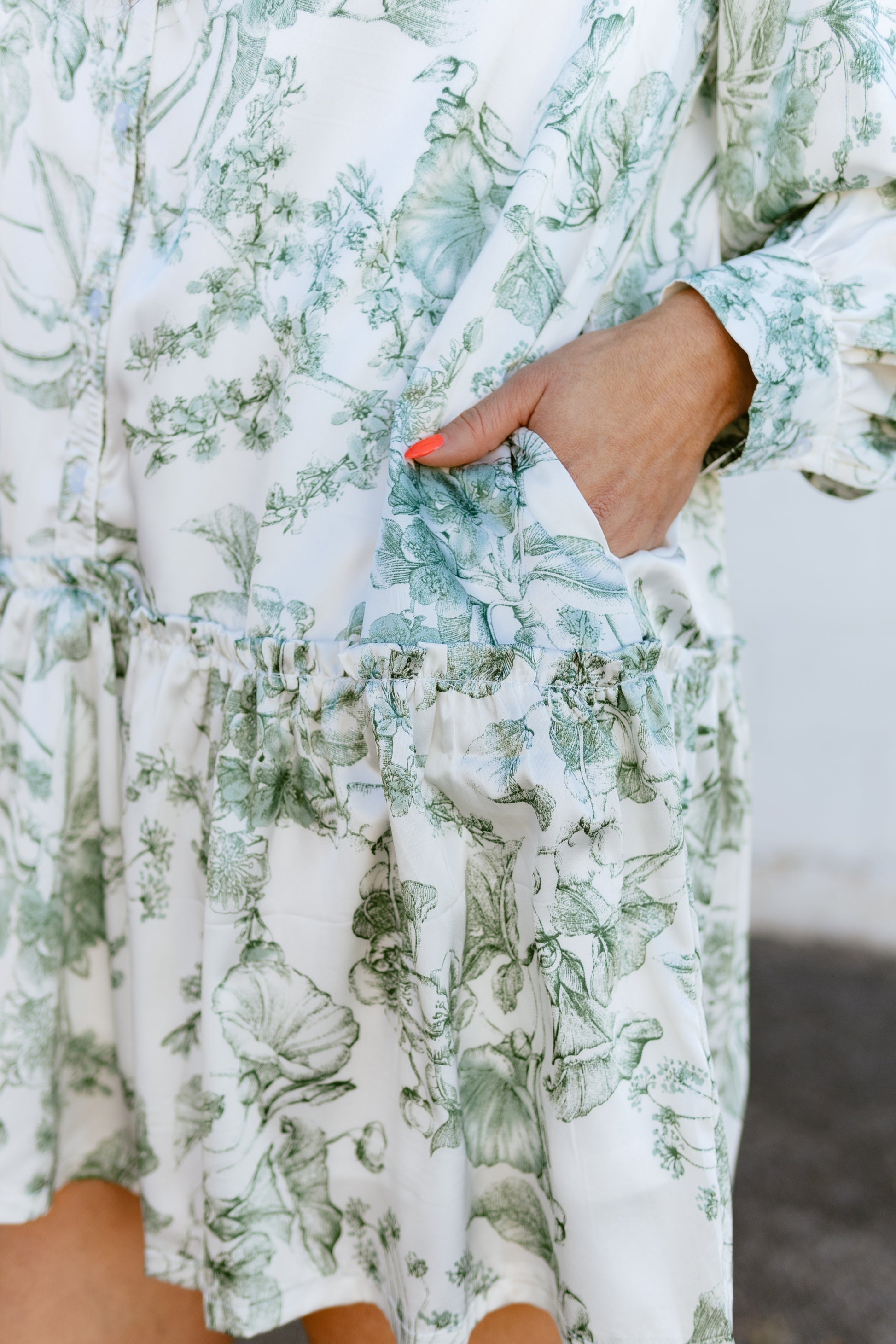 white a-line dress with green floral print